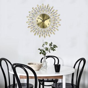 ساعة حائط أنيقة بتصميم شعاع الشمس