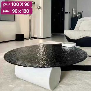 طاولة دائرية مع سطح زجاجي وقاعدة رخامية